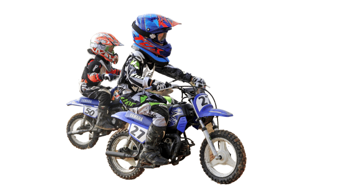 2 boys riding their Yamaha Peewee 50 cc dirt bikes on the trails.